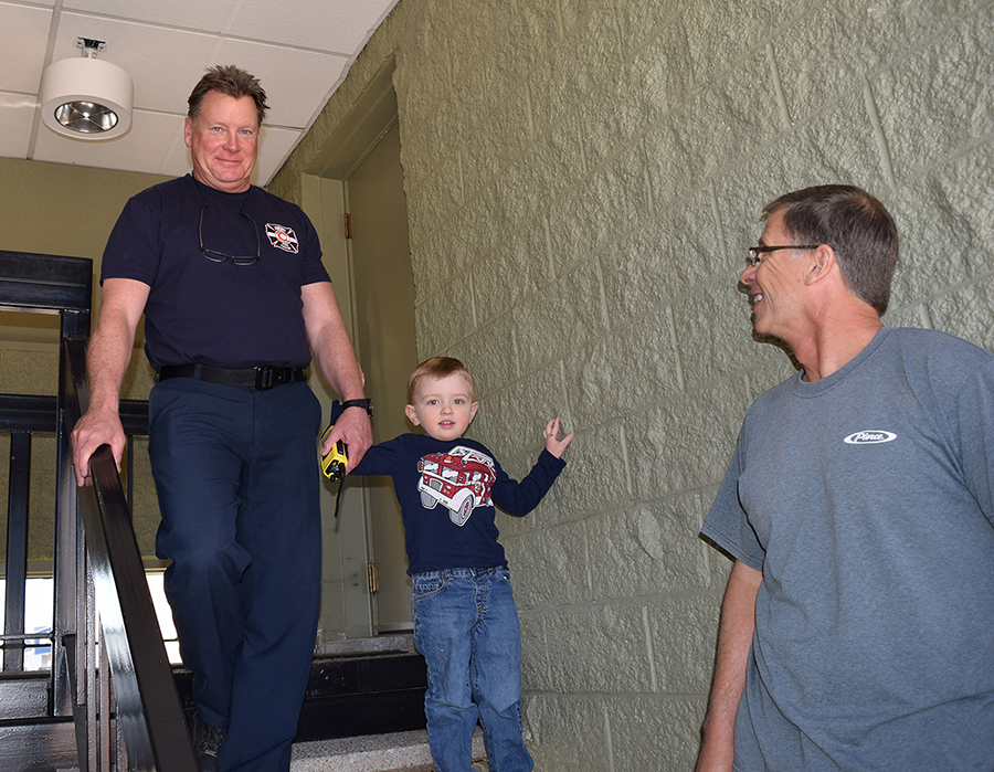 Preschooler with Firefighters