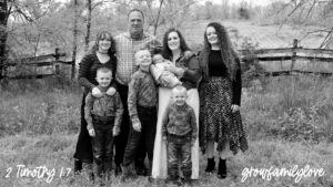 Norm and Heidi Olsen stand with their six children on their Ozarks farm, cradling newborn Neziah - their miracle rainbow baby born almost 12 pounds in 2021 during the pandemic. Celebrating God’s faithfulness after TBI, loss, and healing.