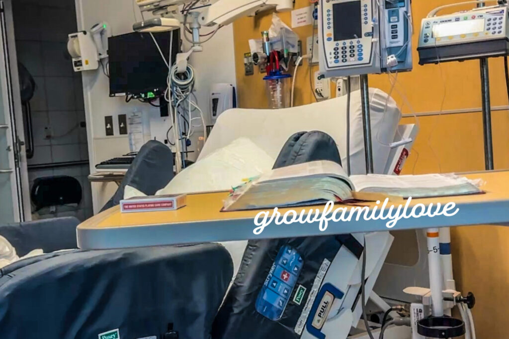 Open Bible on hospital tray as a quiet witness during our stay with Neziah.